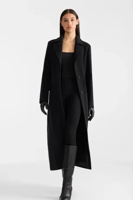 CORAZON Semi-fitted Black Wool Coat The CORAZON black wool coat is designed to create a sleek and feminine look while providing the versatility needed for everyday winter wear. Its classic black finish makes it an easy-to-style wardrobe essential that pairs effortlessly with tailored trousers, knitwear, jeans, dresses and winter boots. Whether you're heading to the office, enjoying a day in the city or dressing for an evening occasion, the CORAZON adds a sophisticated finishing layer to your outfit. Its timeless design makes it a versatile choice for both casual and elevated winter looks. Key Features Semi-fitted silhouette Premium wool construction Classic black finish Elegant and sophisticated design Versatile winter outerwear Easy to style with casual or formal outfits Ideal for everyday and occasion wear Designed for timeless cold-weather styling